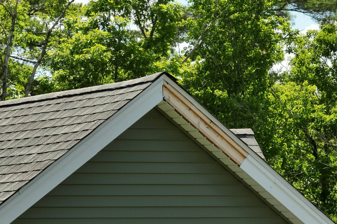 Close-up aerial photo of a roof gable showing trim and shingle condition